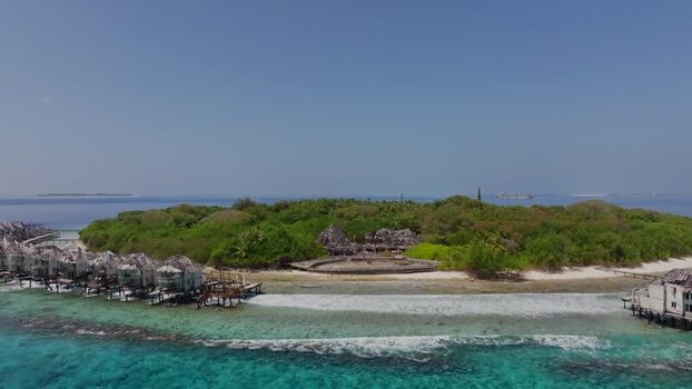Aerial view of huts on the island Maldives. Aerial view of huts on the island Maldives.
