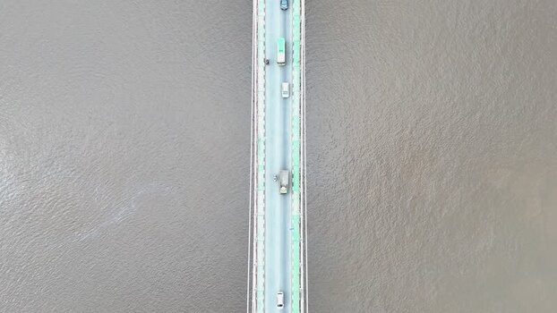 Aerial view of Barito Bridge over the river in Indonesia.