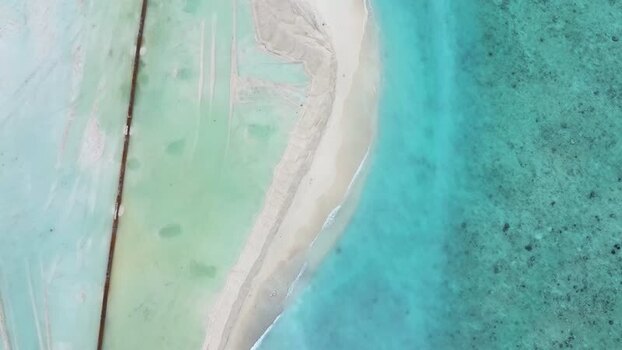 Aerial view of reclamation area and turquoise ocean Maldives. Aerial view of reclamation area and turquoise ocean Maldives.