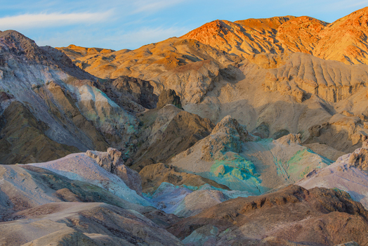 View of the colorful mineral deposits and rugged rock formations of Artists Palette in Death Valley National Park United States.