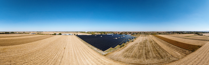 Aerial view of a large solar farm with rows of photovoltaic panels situated in a rural landscape near Temerin Vojvodina Serbia. Aerial view of a large solar farm with rows of photovoltaic panels situated in a rural landscape near Temerin Vojvodina Serbia.