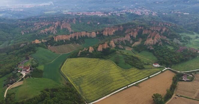 Aerial view of Balze del Valdarno rock formations and green fields Italy. Aerial view of Balze del Valdarno rock formations and green fields Italy.