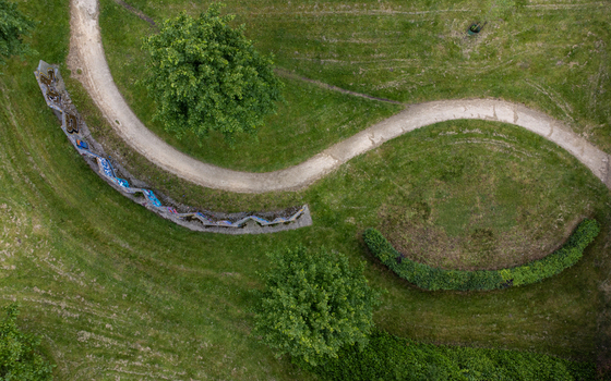Aerial view of winding paths and landscaped greenery contrasting with patches of manicured grass C&eacute;zannestraat Almere Flevoland Netherlands.