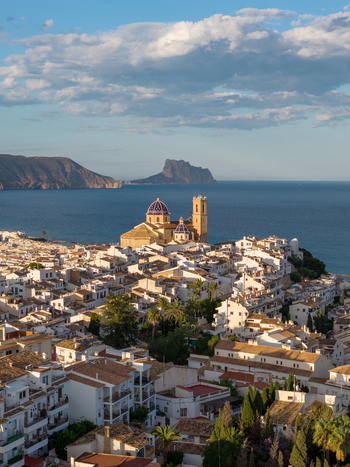 Aerial view of the historic town of Altea with its iconic blue domed church white washed buildings and the Mediterranean Sea in Altea Valencian Community Spain.
