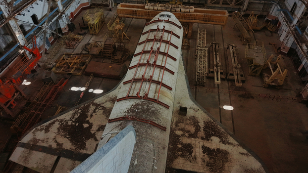 Aerial view of Baikonur Cosmodrome showing an abandoned space shuttle inside a large industrial hangar with metal equipment Karmakshy District Kyzylorda Region Kazakhstan.