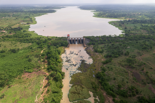 Aerial view of the Asejire Dam its concrete structure stark against the muddy water and vibrant green vegetation Asejire Oyo Nigeria. Aerial view of the Asejire Dam its concrete structure stark against the muddy water and vibrant green vegetation Asejire Oyo Nigeria.