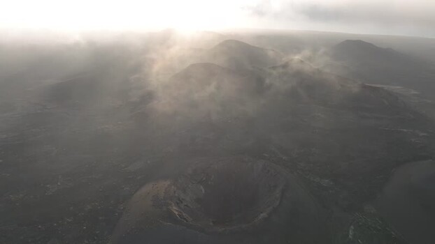 Aerial view of volcanic craters and mist Spain.