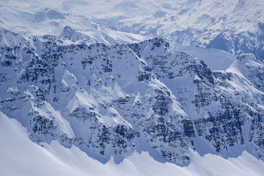 Aerial view of the snow covered mountain peaks and rocky ridges of La Rosiere in the French Alps Montvalezan Auvergne Rhone Alpes France.
