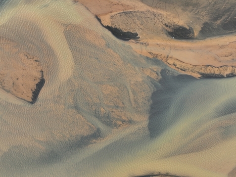 Aerial view of the river delta with intricate patterns of sandbars sediment and flowing water in the landscape near Selfoss Sveitarfelagid Arborg Iceland. Aerial view of the river delta with intricate patterns of sandbars sediment and flowing water in the landscape near Selfoss Sveitarfelagid Arborg Iceland.