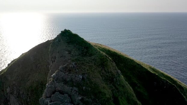 Aerial view of Tormore Island sea stack in Ireland.