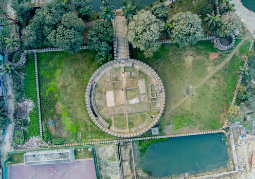 Aerial view of the Idrakpur Fort ruins a historic landmark surrounded by a lush green field with trees ponds and pathways Munshiganj Dhaka Division Bangladesh. Aerial view of the Idrakpur Fort ruins a historic landmark surrounded by a lush green field with trees ponds and pathways Munshiganj Dhaka Division Bangladesh.