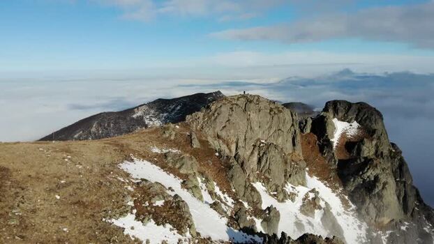 Aerial view of Balkan Mountains peaks above clouds Bulgaria.