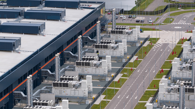 Aerial view of the large data center facility at Agriport with industrial cooling systems and modern infrastructure in Middenmeer Noord Holland Netherlands. Aerial view of the large data center facility at Agriport with industrial cooling systems and modern infrastructure in Middenmeer Noord Holland Netherlands.