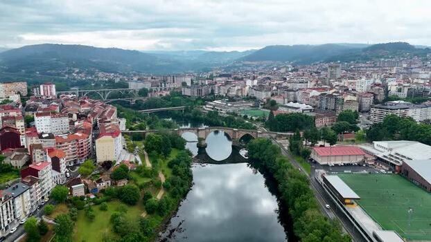 Aerial view of Ponte Vella de Ourense crossing the Minho river Spain. Aerial view of Ponte Vella de Ourense crossing the Minho river Spain.