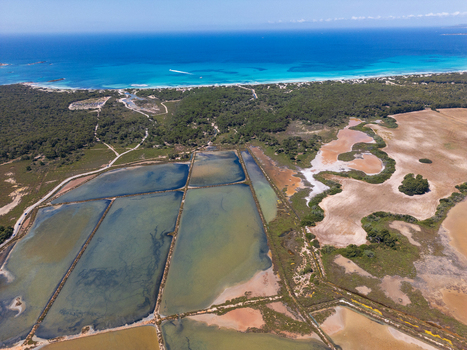 Aerial view of Salines des Trenc salt pans with turquoise sea and white sand beach in Campos Islas Baleares Spain. Aerial view of Salines des Trenc salt pans with turquoise sea and white sand beach in Campos Islas Baleares Spain.
