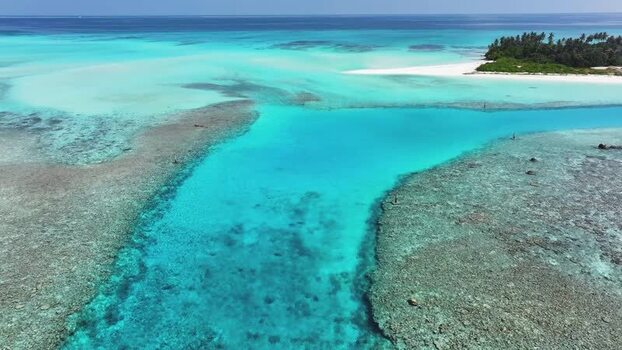 Aerial view of the turquoise lagoon and coral reefs in Maldives. Aerial view of the turquoise lagoon and coral reefs in Maldives.