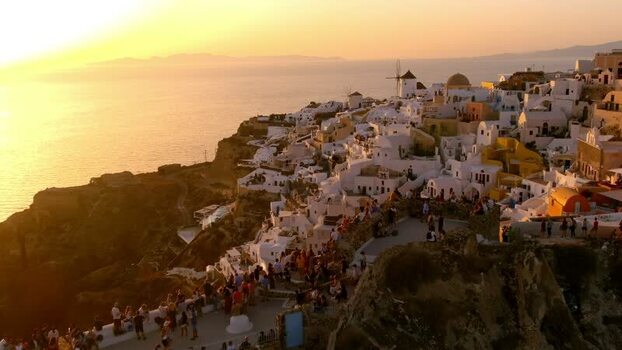 Aerial view of Oia village at sunset in Santorini Greece. Aerial view of Oia village at sunset in Santorini Greece.