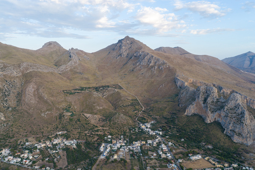 Aerial view of Riserva Naturale Orientata dello Zingaro with its rugged limestone mountains coastal trails and the nearby town of San Vito Lo Capo Sicilia Italy. Aerial view of Riserva Naturale Orientata dello Zingaro with its rugged limestone mountains coastal trails and the nearby town of San Vito Lo Capo Sicilia Italy.