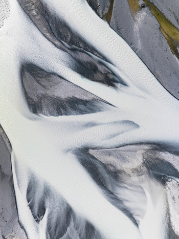 Aerial view of a river with contrasting white and dark sandbanks creating dynamic patterns Lake Tekapo Canterbury Region New Zealand. Aerial view of a river with contrasting white and dark sandbanks creating dynamic patterns Lake Tekapo Canterbury Region New Zealand.