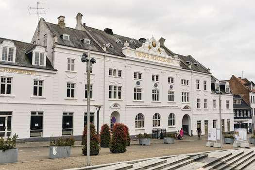 Viborg Denmark 07 August 2026 View of the historic Viborg Afholdshiem building a white neoclassical structure with ornate gables and arched windows in the city center. Viborg Denmark 07 August 2026 View of the historic Viborg Afholdshiem building a white neoclassical structure with ornate gables and arched windows in the city center.