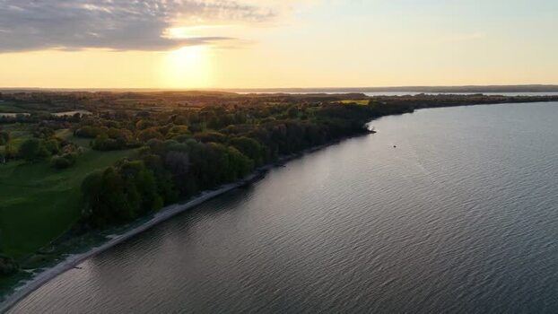 Aerial view of Bockholmwik coastline at sunset Germany.
