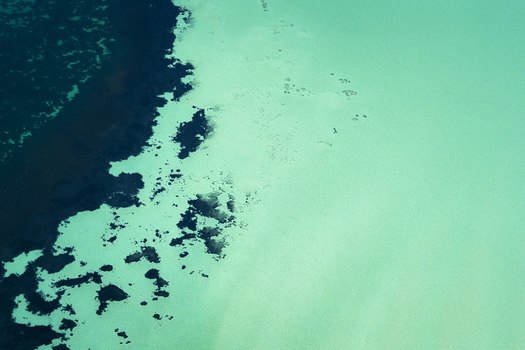 Aerial view of turquoise ocean patterns and dark reef formations in the shallow waters of the Shire of Shark Bay Western Australia Australia. Aerial view of turquoise ocean patterns and dark reef formations in the shallow waters of the Shire of Shark Bay Western Australia Australia.