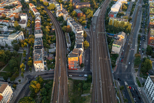 Aerial view of Ostkreuz railway station area with tracks surrounding residential buildings and urban infrastructure in the late afternoon light Berlin Berlin Germany. Aerial view of Ostkreuz railway station area with tracks surrounding residential buildings and urban infrastructure in the late afternoon light Berlin Berlin Germany.
