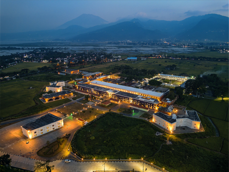 Aerial view of the historic Benteng Fort Willem I illuminated at night surrounded by lush rice fields and distant mountains in Ambarawa Central Java Indonesia. Aerial view of the historic Benteng Fort Willem I illuminated at night surrounded by lush rice fields and distant mountains in Ambarawa Central Java Indonesia.