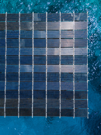Aerial view of SolarSea floating solar power plant by Swimsol on the turquoise ocean water Dharavandhoo Baa Atoll Maldives. Aerial view of SolarSea floating solar power plant by Swimsol on the turquoise ocean water Dharavandhoo Baa Atoll Maldives.