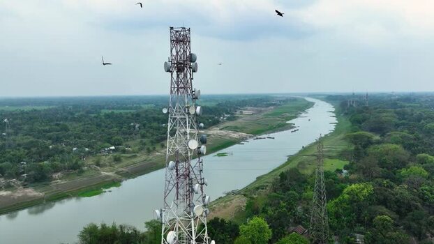 Aerial view of a telecommunications tower near a river. Aerial view of a telecommunications tower near a river.