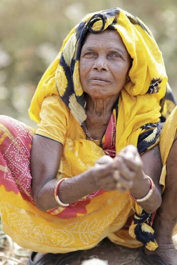 Odisha India 26 March 2026 View of an elderly woman with a yellow headscarf and red bangles her weathered hands clasped embodying a life etched with resilience and grace. Odisha India 26 March 2026 View of an elderly woman with a yellow headscarf and red bangles her weathered hands clasped embodying a life etched with resilience and grace.