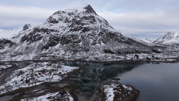 Aerial view of snowy Lofoten mountains in winter Norway.