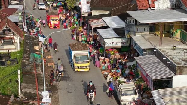 Aerial view of a busy street market with trucks and people Indonesia. Aerial view of a busy street market with trucks and people Indonesia.