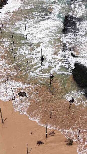 Aerial view of stilt fishermen in the ocean Sri Lanka. Aerial view of stilt fishermen in the ocean Sri Lanka.