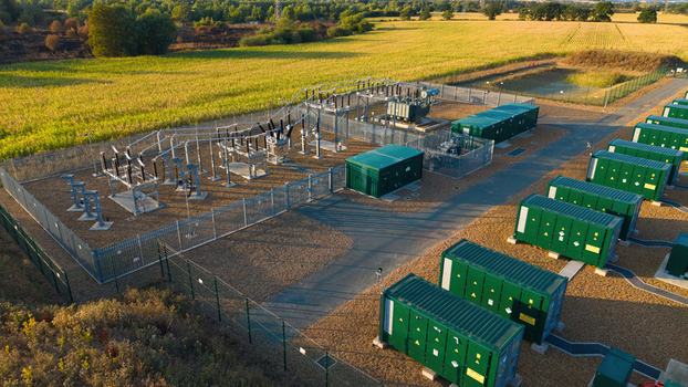 Aerial view of Battery Energy Storage System at BESS Grendon with green battery containers and electrical infrastructure in Northampton England United Kingdom. Aerial view of Battery Energy Storage System at BESS Grendon with green battery containers and electrical infrastructure in Northampton England United Kingdom.