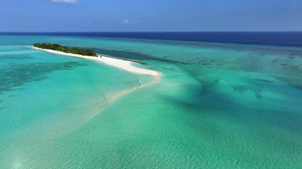 Aerial view of a tropical island and sandbank Maldives.