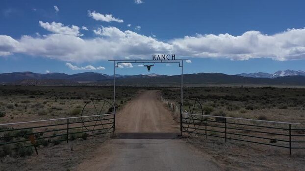 View of a long dirt road towards distant mountains United States. View of a long dirt road towards distant mountains United States.