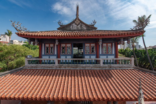 View of the traditional orange tiled roof and ornate architecture of Chihkan Tower in Chihkan Village Tainan City Taiwan. View of the traditional orange tiled roof and ornate architecture of Chihkan Tower in Chihkan Village Tainan City Taiwan.