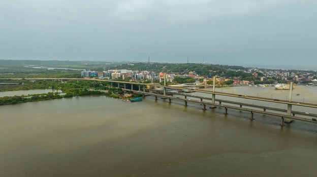 Aerial view of the Atal Setu bridge spanning the Mandovi River with the cityscape of Panaji in the background in Panaji Goa India.