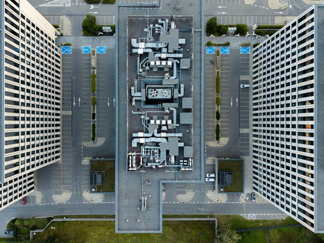 Aerial view of a modern data center roof featuring complex HVAC systems and ventilation ducts flanked by office buildings and parking areas Krakow Lesser Poland Voivode Poland. Aerial view of a modern data center roof featuring complex HVAC systems and ventilation ducts flanked by office buildings and parking areas Krakow Lesser Poland Voivode Poland.