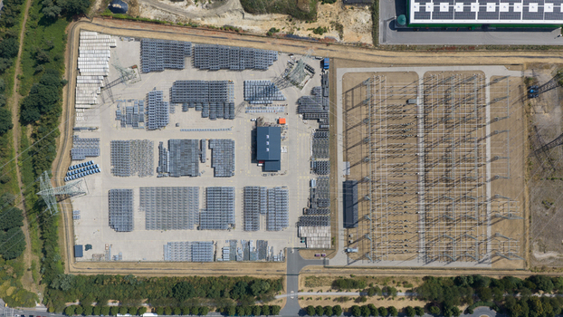 Aerial view of the Amprion Gmbh electrical substation featuring organized rows of industrial equipment metal structures and transformers in Herten Nordrhein Westfalen Germany.