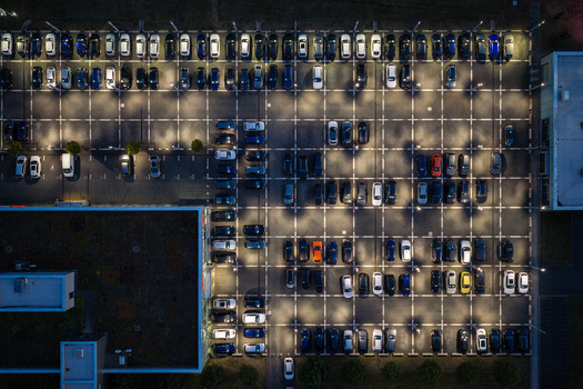 Aerial view of the Audi Zentrum Berlin Adlershof parking lot at night filled with parked cars under bright artificial lighting showing rows of vehicles in Berlin Berlin Germany.