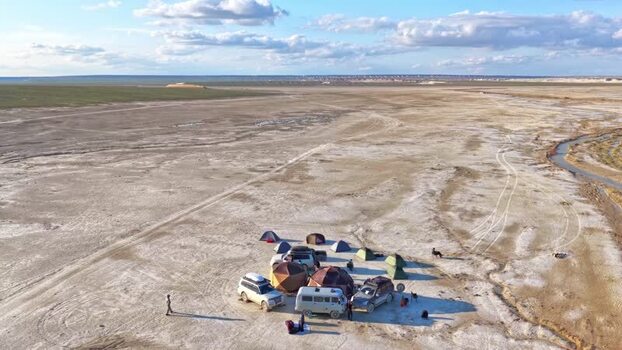 Aerial view of a campsite with off road vehicles Kazakhstan. Aerial view of a campsite with off road vehicles Kazakhstan.