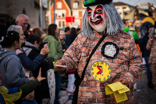Basel Switzerland 10 March 2025 View of a performer in a brick patterned costume and a striking mask amidst the Fasnacht celebration offering a glimpse into the city s vibrant cultural heritage. Basel Switzerland 10 March 2025 View of a performer in a brick patterned costume and a striking mask amidst the Fasnacht celebration offering a glimpse into the city s vibrant cultural heritage.