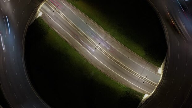 Aerial view of roundabout with cars at night Portugal.