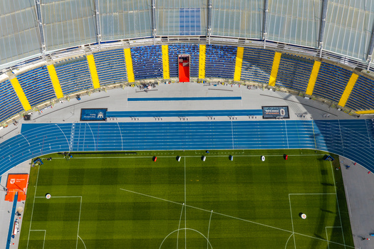 Chorzow Poland 17 September 2026 Aerial view of Silesian Stadium showing the blue running track green football pitch and blue and yellow seating.