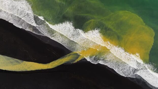 Aerial view of Jokulsarlon glacier lagoon and black sand Iceland.