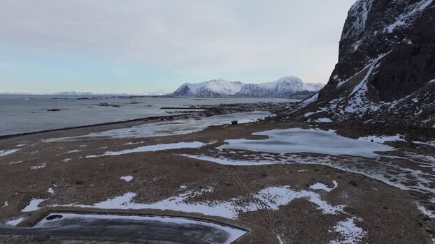 Aerial view of Lofoten mountains and icy landscape Norway.