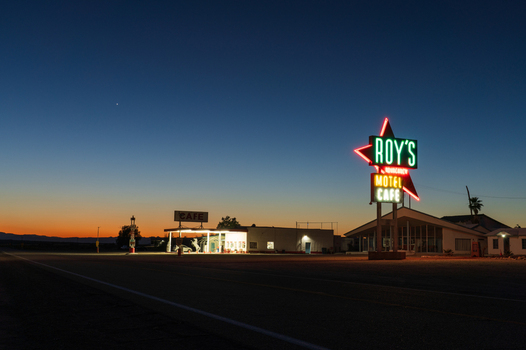 Amboy United States 07 April 2026 View of Roy s Motel and Cafe glows under the twilight sky casting long shadows across the empty National Trails Highway. Amboy United States 07 April 2026 View of Roy s Motel and Cafe glows under the twilight sky casting long shadows across the empty National Trails Highway.