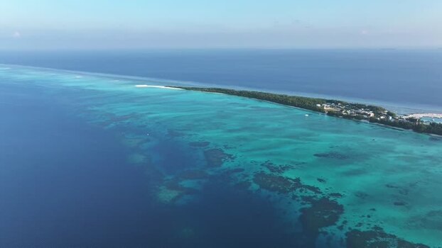 Aerial view of Fulhadhoo island and coral reefs Maldives. Aerial view of Fulhadhoo island and coral reefs Maldives.